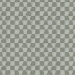 Detail of printed wallpaper in a watercolor ikat-inspired checkerboard pattern in tonal shades of grey. 