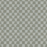 Detail of printed wallpaper in a watercolor ikat-inspired checkerboard pattern in tonal shades of grey. 