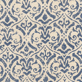 Detail of fabric in a botanical damask print in navy on a cream field.