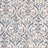 Detail of fabric in a botanical damask print in blue-gray on a cream field.
