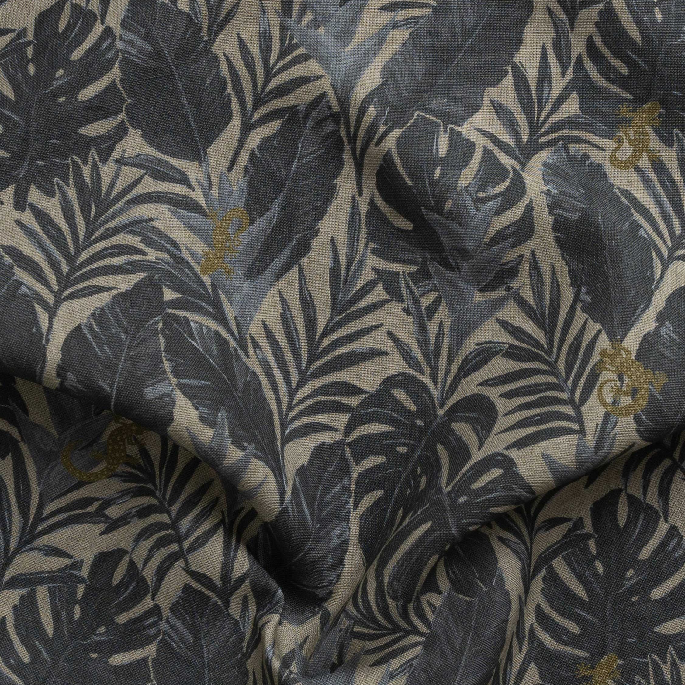 Detail of gently draped printed fabric in a tropical palm frond pattern in muted steel blue scattered with small tan lizards. 