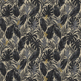 Detail of printed fabric in a tropical palm frond pattern in faded black and charcoal grey scattered with small tan lizards. 