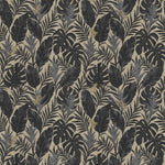 Detail of printed wallpaper in a tropical palm frond pattern in faded black and charcoal grey scattered with small tan lizards. 