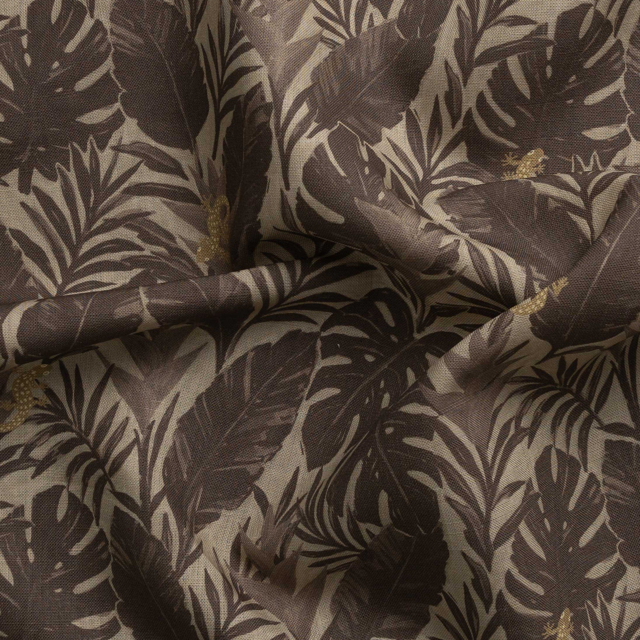 Detail of gently draped printed fabric in a tropical palm frond pattern in tonal brown scattered with small tan lizards. 