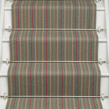 Striped flatweave runner in tan red and blue on white staircase