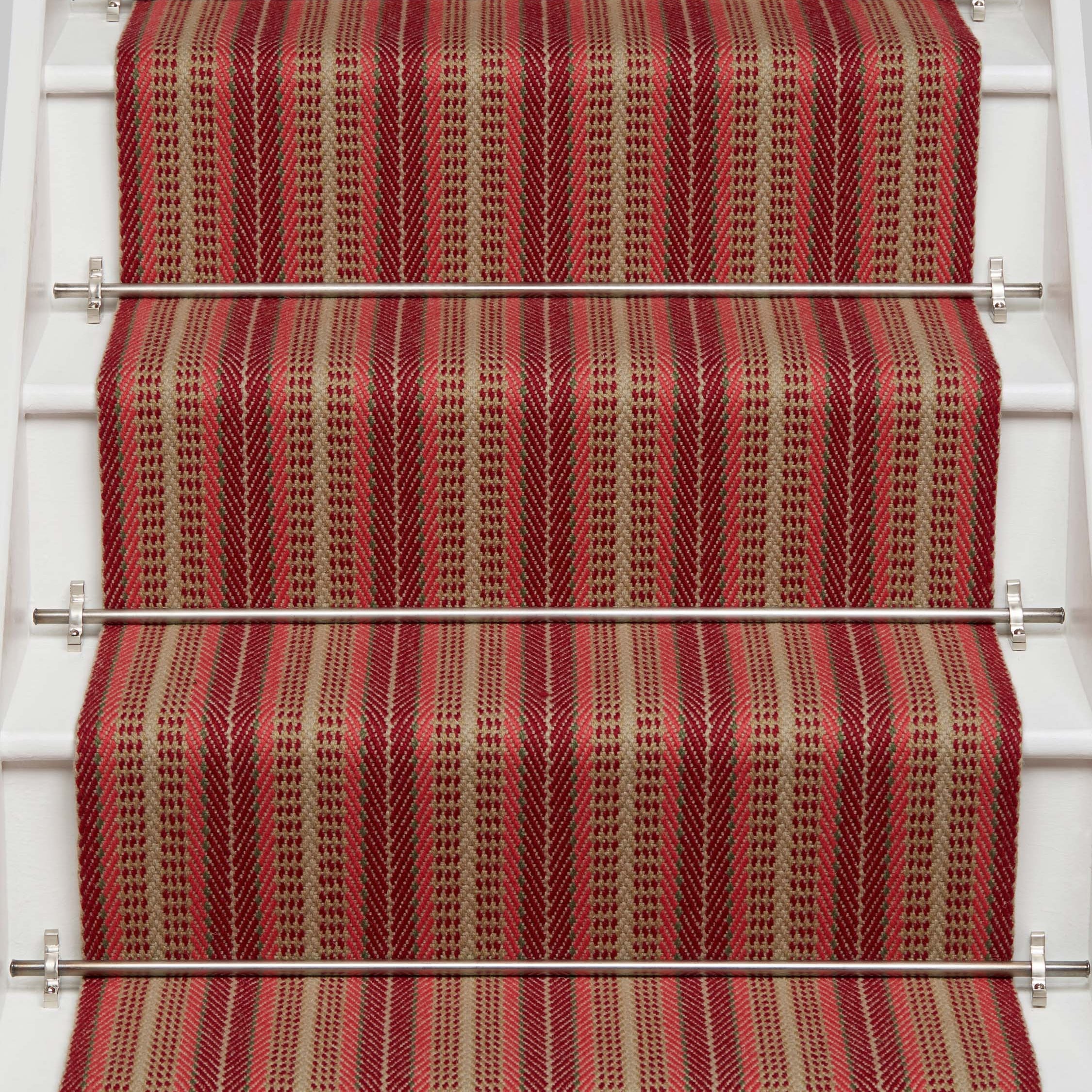 Striped flatweave runner in red and tan on white staircase