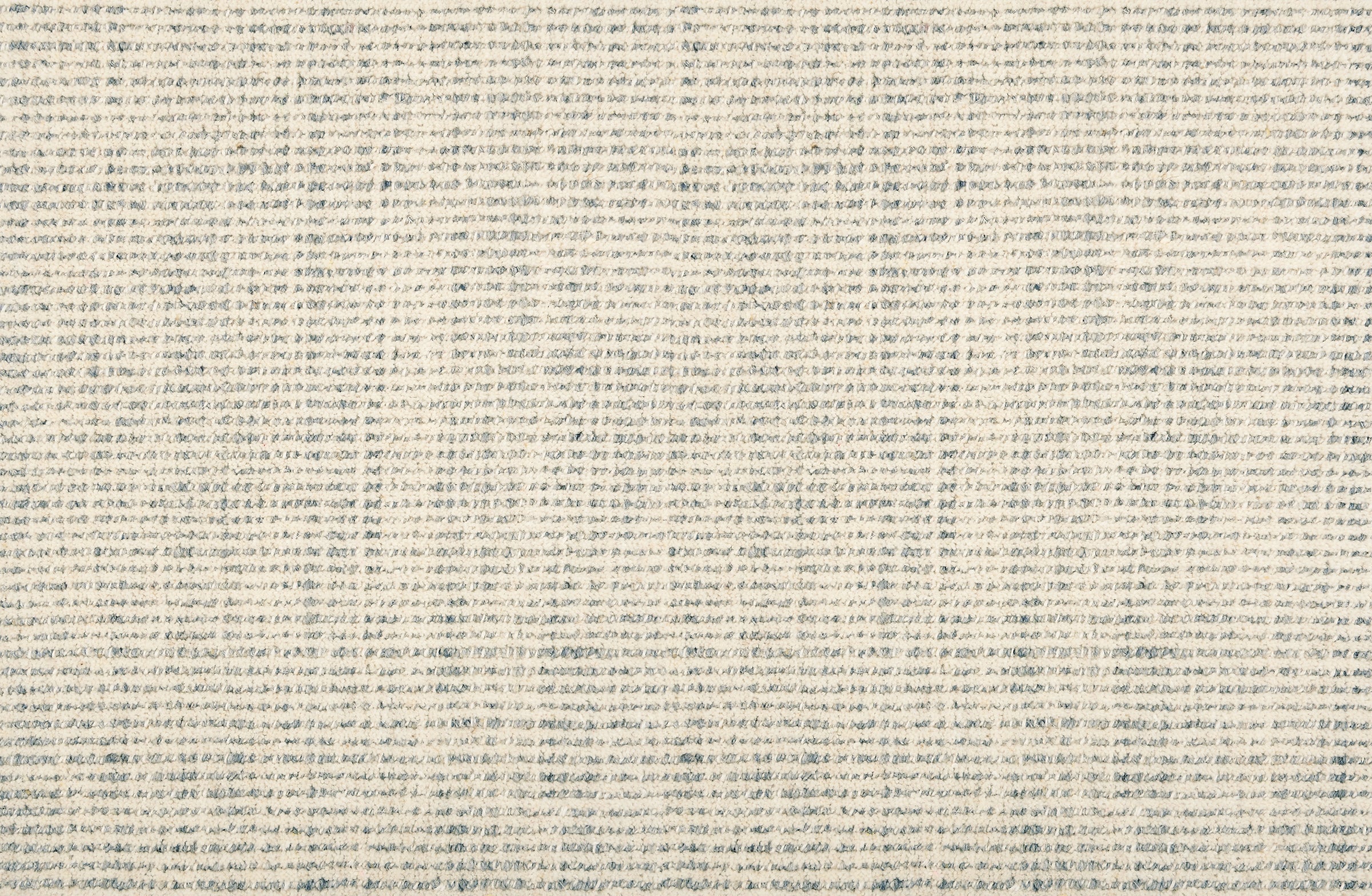 Broadloom carpet in subtle stripe in light blue.