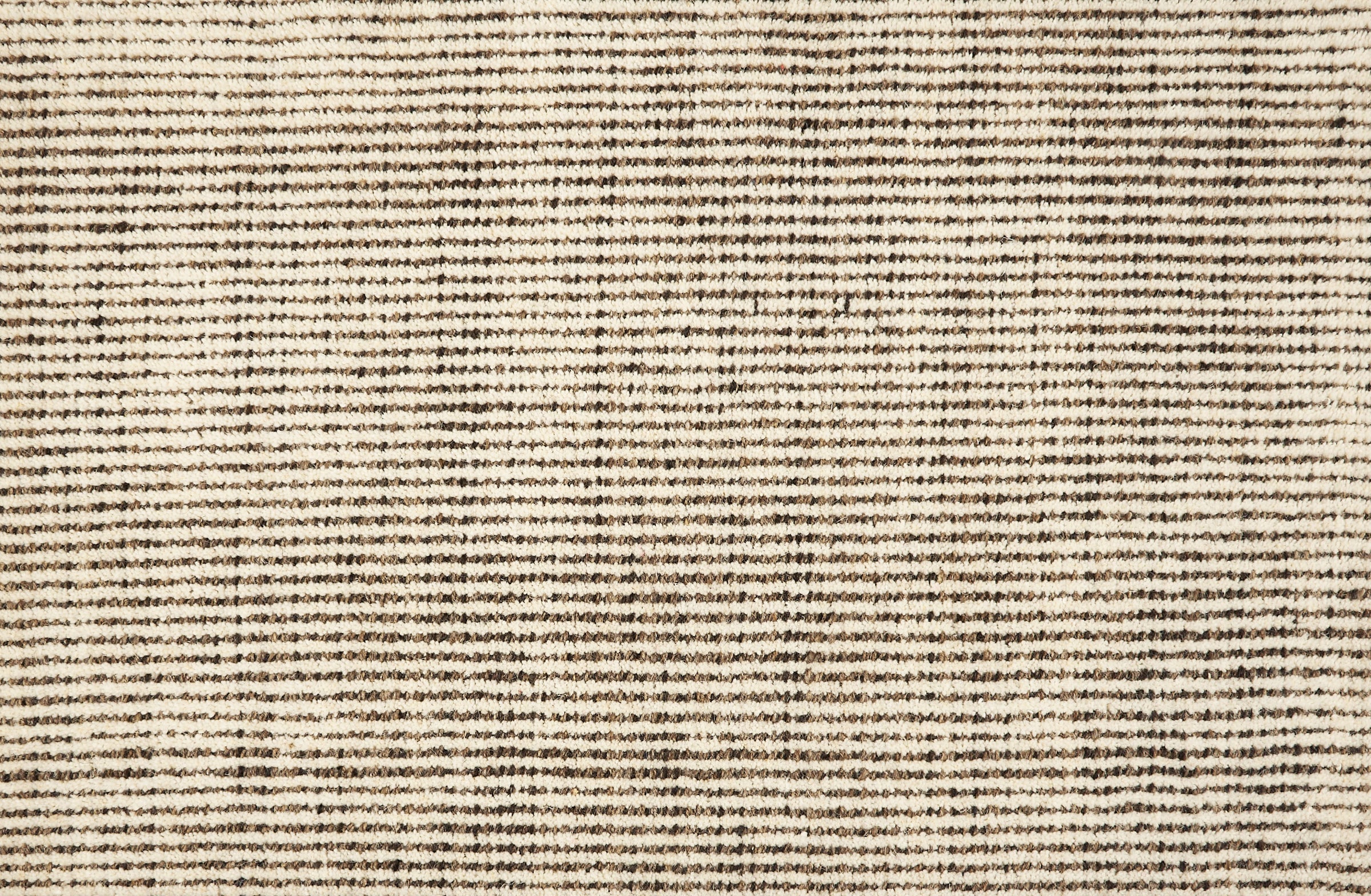 Broadloom carpet in subtle stripe in brown and cream