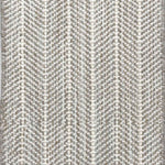 Close up of broadloom carpet with striated herringbone weave in white with accents of grey and taupe.
