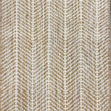 Close up of broadloom carpet with striated herringbone weave in white with accents of tan and brown.