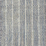 Close up of broadloom carpet with striated herringbone weave in white with accents of blue and brown.