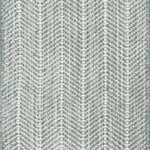 Close up of broadloom carpet with striated herringbone weave in white with accents of slate blue.