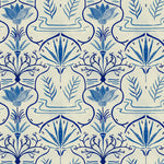 Detail of wallpaper in an intricate floral lattice print in shades of blue on a cream field.