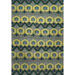 Patterned rug with green and blue botanical design on a white background