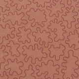 Detail of a wabric with an abstract embroidered pattern in clay pink on a clay pink field.