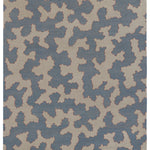 Handwoven rug in an abstract coral design in blue and white with a red accent.