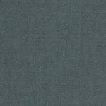 Detail of fabric with an abstract embroidered pattern in gray on a gray field.