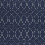 Wallpaper in a playful floral lattice print in white and tan on a navy blue field.