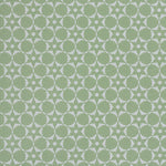 Wallpaper in a floral lattice print in  jade green on a cream field.