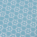 Wallpaper detail in a floral lattice print in  cream on a powder blue field.