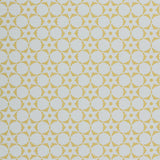 Wallpaper in a floral lattice print in  yellow on a cream field