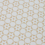 Detail of a wallpaper in a floral lattice print in tan on a cream field.