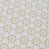 Detail of a wallpaper in a floral lattice print in tan on a cream field.
