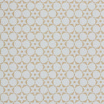 Wallpaper in a floral lattice print in tan on a cream field.