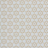 Wallpaper in a floral lattice print in tan on a cream field.