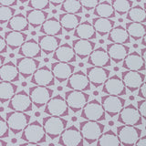 Wallpaper detail in a floral lattice print in  purple on a cream field.