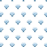 Detail of wallpaper in a playful bouquet print in blue and navy on a white field.