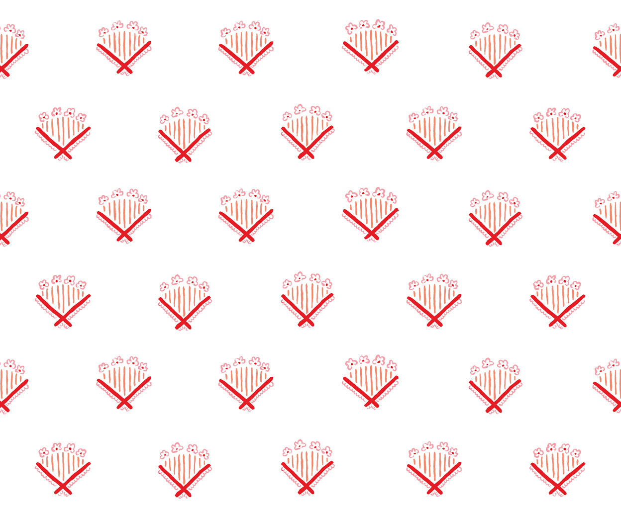 Detail of fabric in a playful bouquet print in red and orange on a white field.