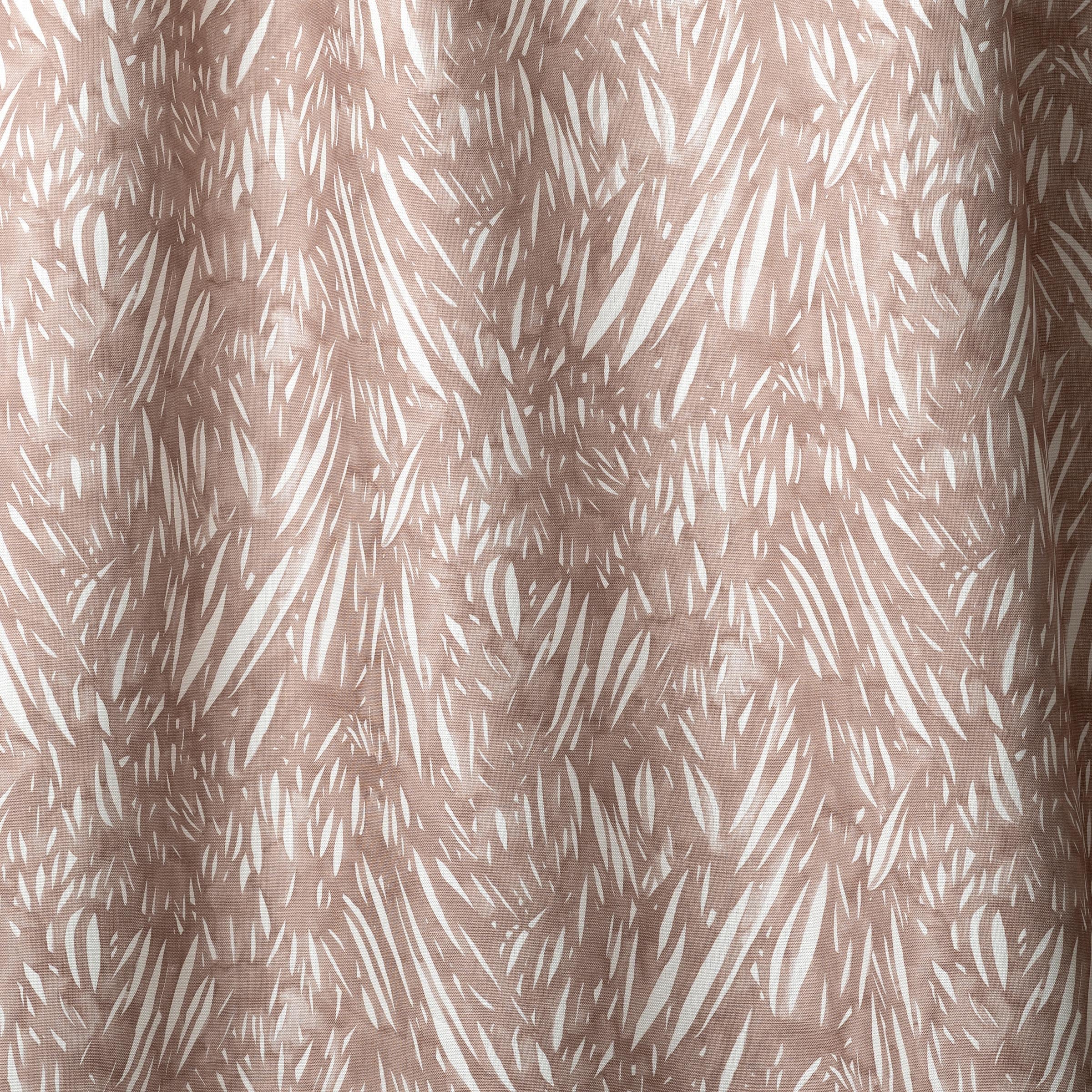 Draped linen in  an abstract leaf pattern in white on a warm brown watercolor field.