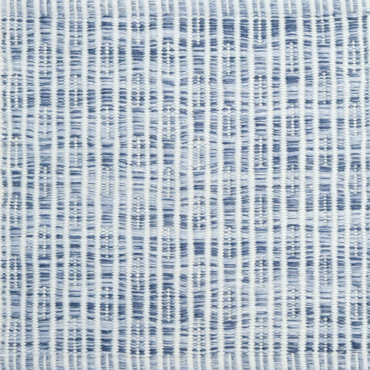 Flatweave rug in a solid and dashed stripe in cream on strié blue field