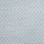 Flatweave rug in a small scale zigzag dot stripe in cream on a light grey field.