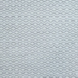 Flatweave rug in a small scale zigzag dot stripe in cream on a light grey field.