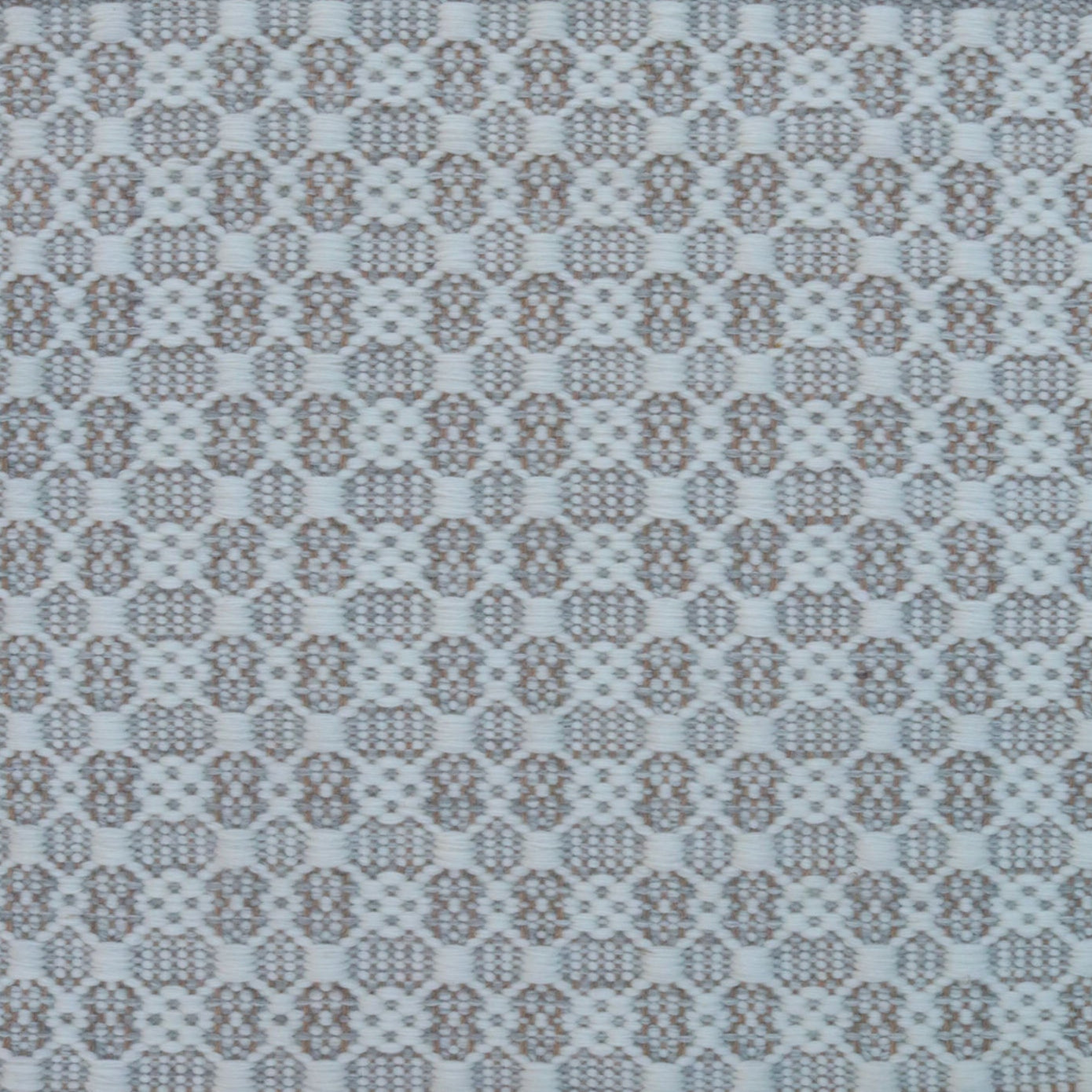 Flatweave rug in a small scale decorative lattice design in cream on a pale grey field.