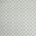 Flatweave rug in a small scale decorative lattice design in cream on a grey and tan field. 