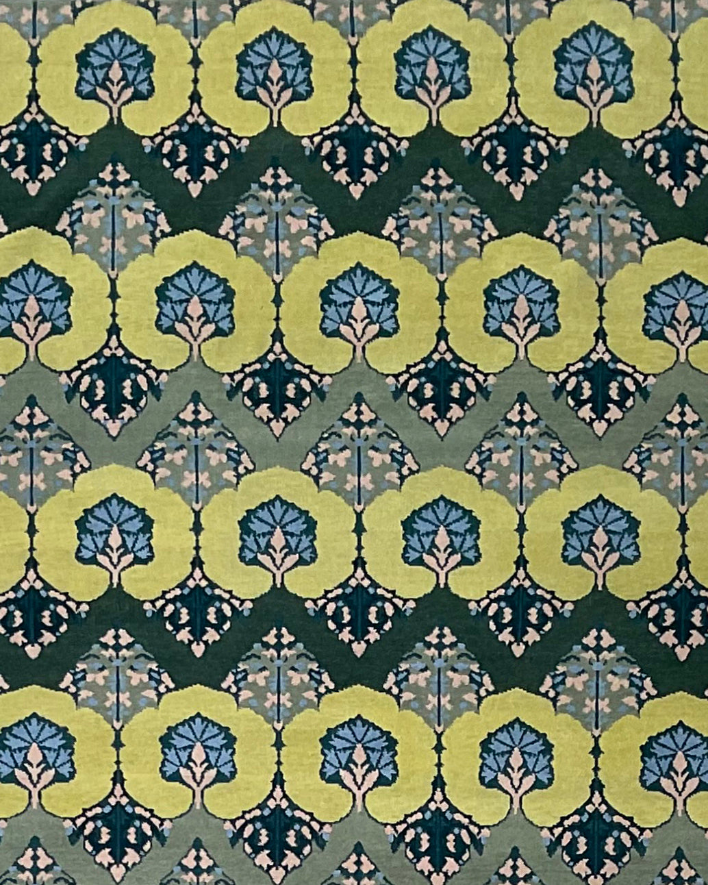 Patterned rug with green and blue botanical design