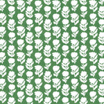 Detail of fabric in a classic floral silhouette print in cream on a gree field