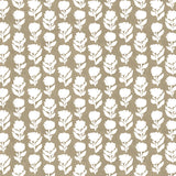Detail of fabric in a classic floral silhouette print in cream on a brown field