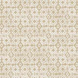 Detail of fabric in a gridded damask print in white on a tan field.