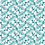 Detail of wallpaper in painterly diamond print in blue and turquoise on a white field.