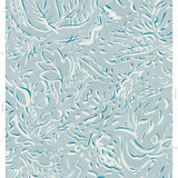 Detail of wallpaper in a painterly botanical print in white and blue on a light blue field.