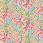 Detail of fabric in a large-scale floral pattern in a rainbow of pastels on a tan field.