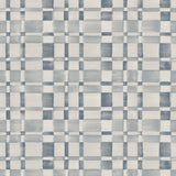 Wallpaper in a large-scale checked pattern in shades of steel blue and pale grey.
