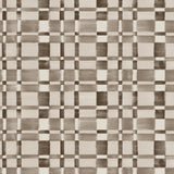 Wallpaper in a large-scale checked pattern in shades of charcoal and pale grey.