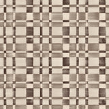 Detail of fabric in a large-scale checked pattern in shades of charcoal grey and cream.