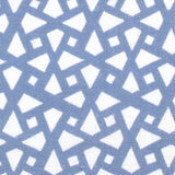 Detail of fabric in a geometric lattice print in blue on a white field.