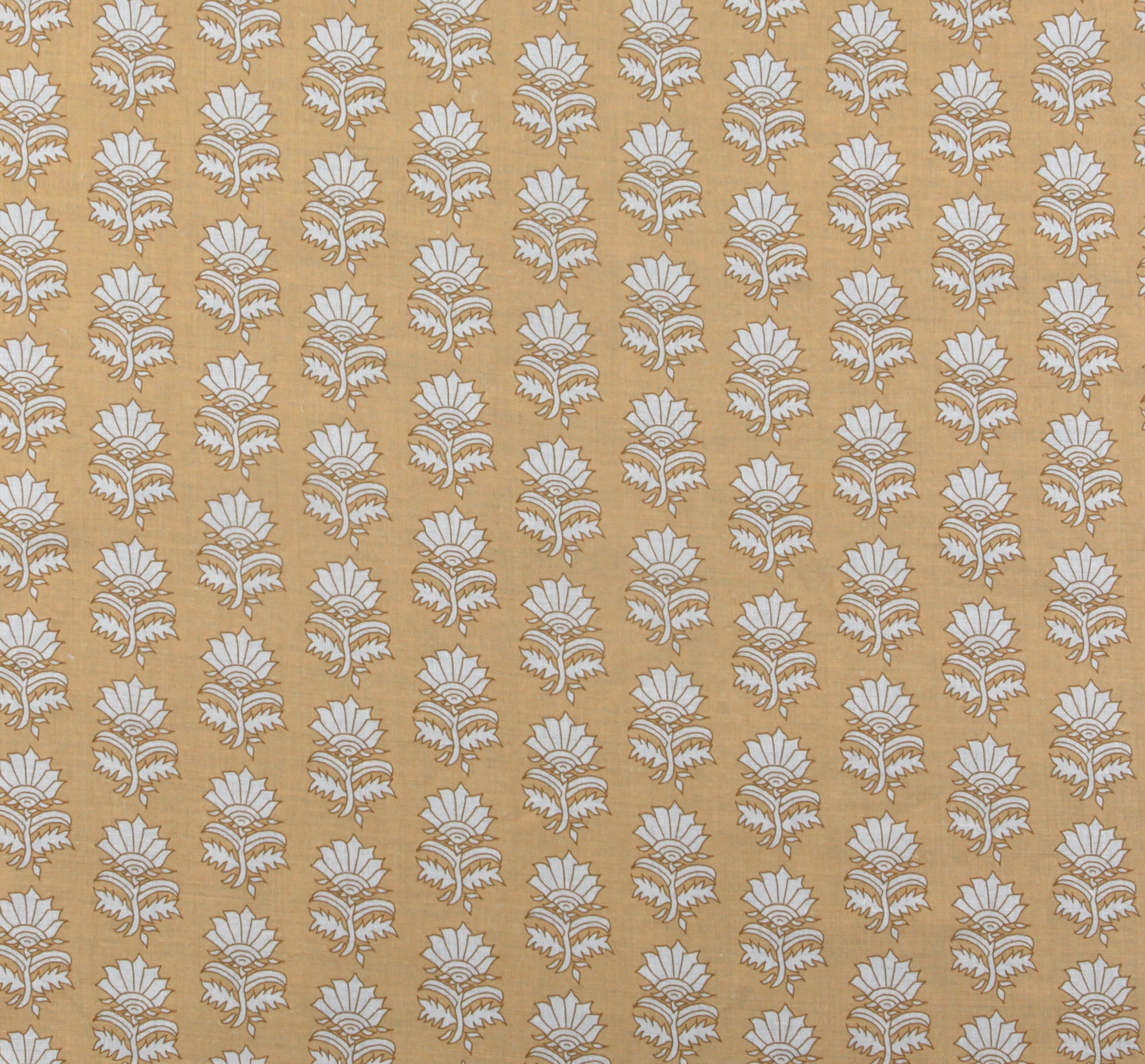 Detail of fabric in a repeating thistle print in cream and rust on an orange field.